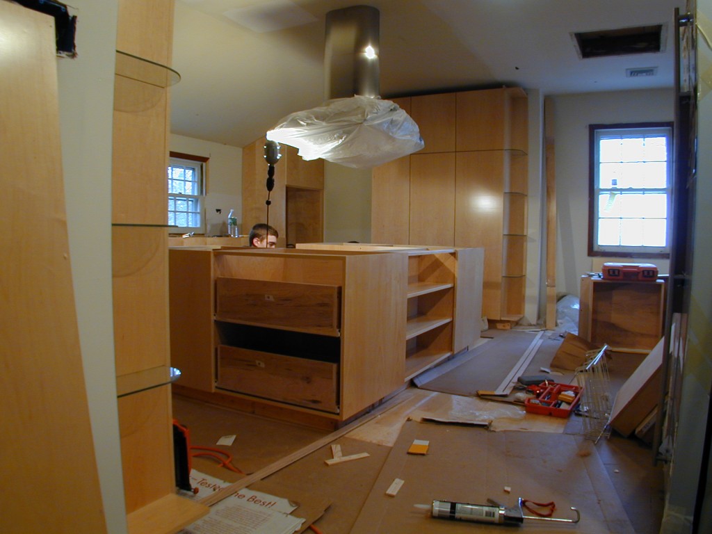 modern kitchen island being installed